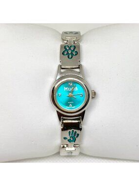 Mudd women’s watch flower & handprint motifs silver blue tone 19mm 7” running